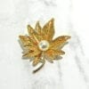 GOLDEN TEXTURED LEAF PIN WITH PEARL - Image 4