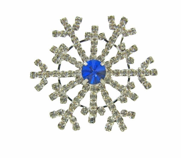 snowflake brooch with large blue center gem
