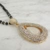 necklace pendant with teardrop pearl design on marble surface