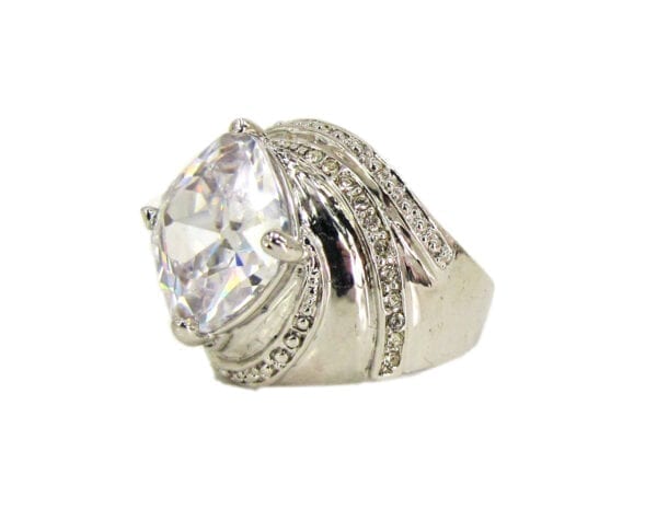 ring with twisting design and white gem inset