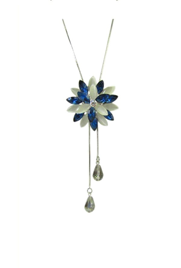 floral necklace pendant with blue gems and a tassel