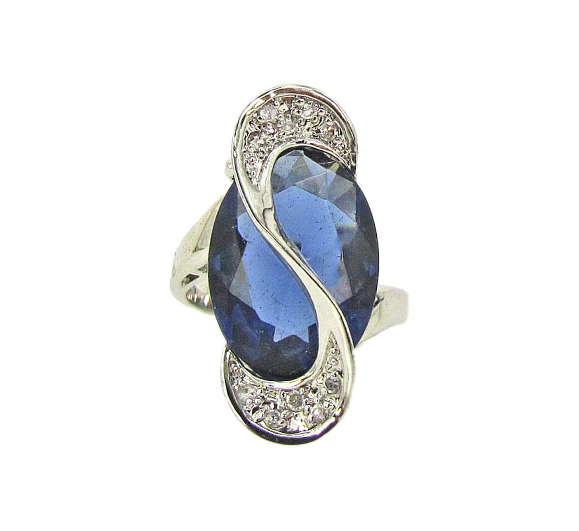 ring with s-shaped accent and a sapphire gem
