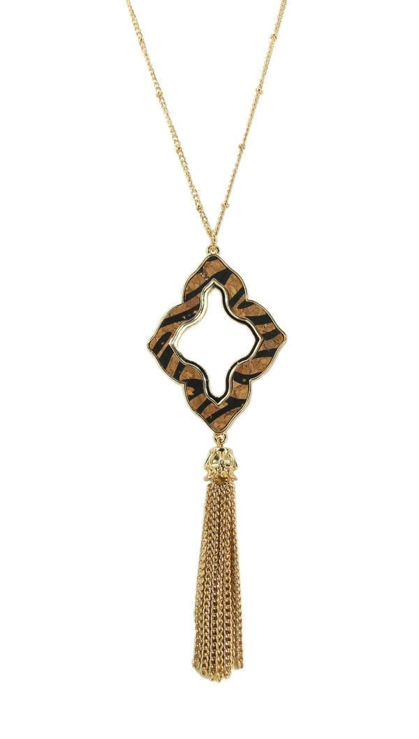 necklace with animal print design and brown tassel