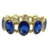 golden bracelet with deep blue gems