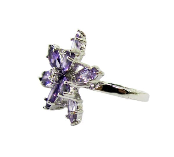 side view of a ring with violet gems arranged in a starburst