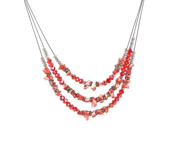 segment of a layered necklace with red beads