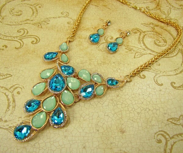 necklace with light blue and turquoise gemstones on cloth surface