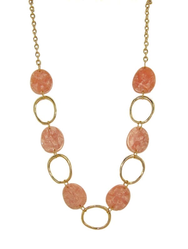 golden necklace with large hoops and pink flat beads