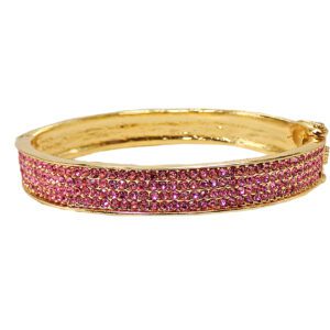 A pink crystal bangle and bracelet with gold coating