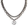 A crystal pendant on black double link chain