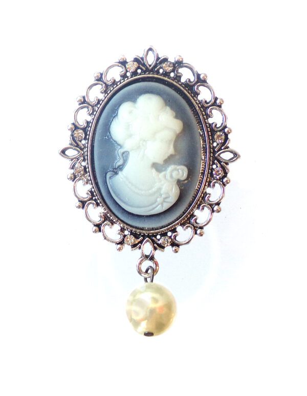 A Brooch With a Woman Figure With a Pearl