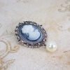 Brooch With a Woman White Figure With a Pearl Front