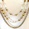 GOLD LAYERED NECKLACE WITH GLASS AND METAL BEADS IN AN ANTIQUE GOLD FINISH - Image 7