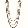 GOLD LAYERED NECKLACE WITH GLASS AND METAL BEADS IN AN ANTIQUE GOLD FINISH - Image 2