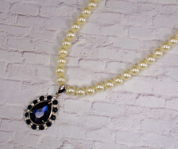 WHITE PEARL NECKLACE WITH BLUE CRYSTAL TEARDROP PENDANT - Image 7