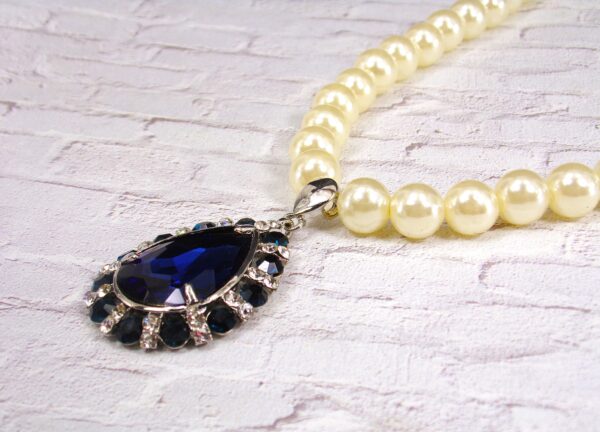 WHITE PEARL NECKLACE WITH BLUE CRYSTAL TEARDROP PENDANT - Image 2