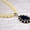 WHITE PEARL NECKLACE WITH BLUE CRYSTAL TEARDROP PENDANT - Image 4