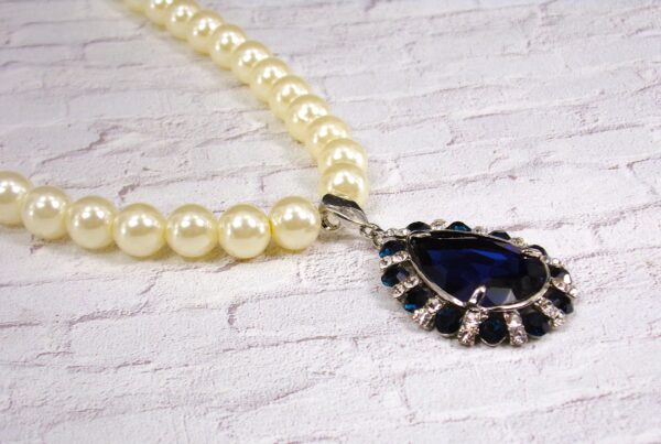 WHITE PEARL NECKLACE WITH BLUE CRYSTAL TEARDROP PENDANT - Image 4