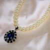 WHITE PEARL NECKLACE WITH BLUE CRYSTAL TEARDROP PENDANT - Image 5