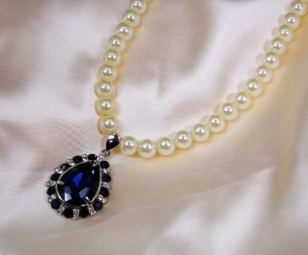 WHITE PEARL NECKLACE WITH BLUE CRYSTAL TEARDROP PENDANT - Image 5