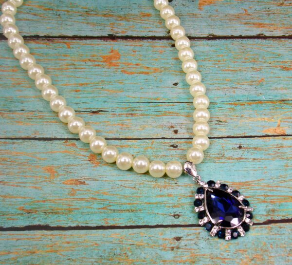 WHITE PEARL NECKLACE WITH BLUE CRYSTAL TEARDROP PENDANT - Image 6