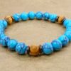 TURQUOISE STONE AND WOOD BEAD BRACELET - Image 4